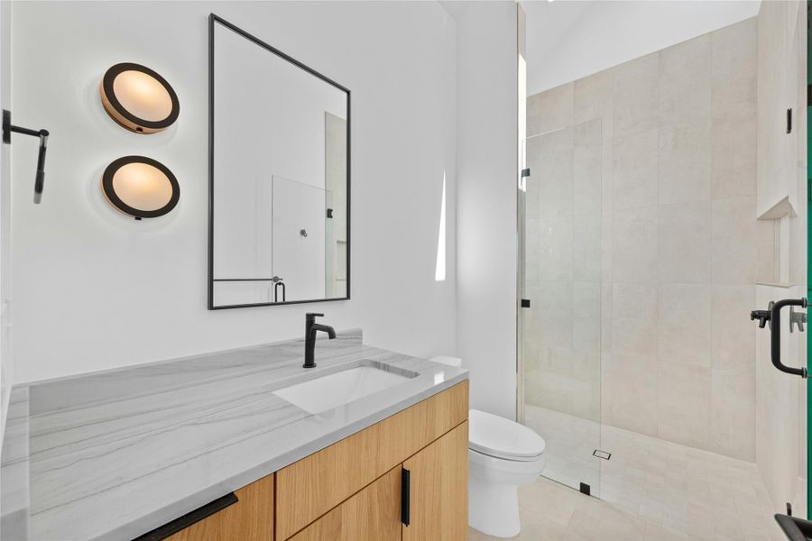 Full Bathroom with high ceilings, gorgeous skylight and accessible from the living room