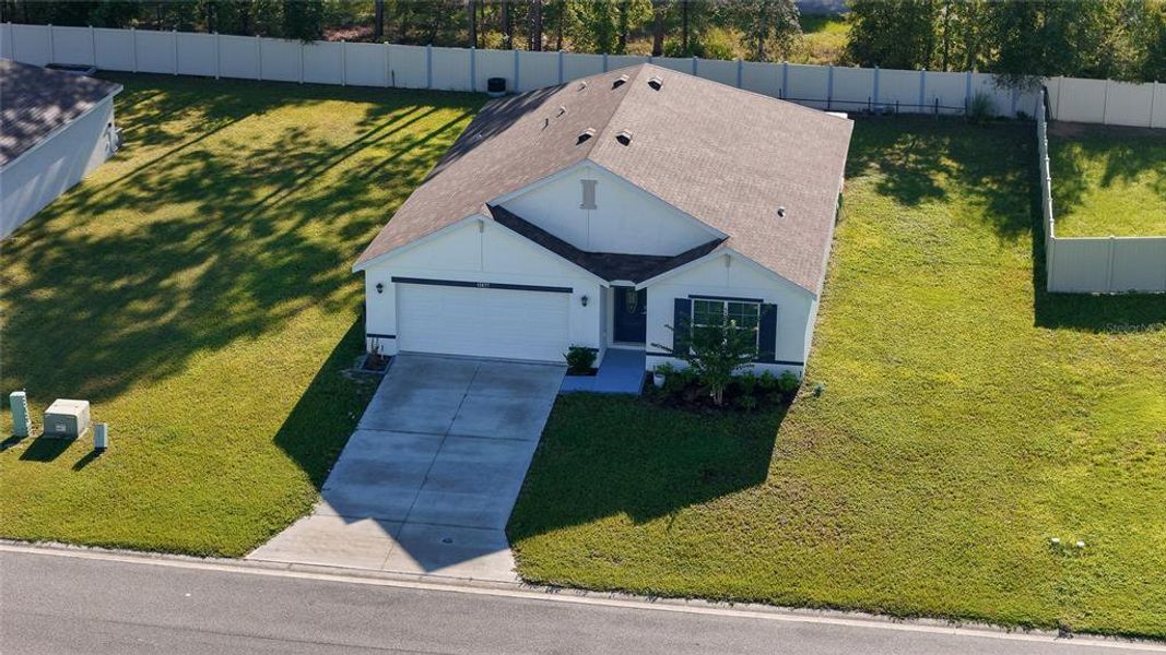 Front exterior of a new home in Huntington Ridge, Ocala, FL, highlighting curb appeal (Image 2). Front exterior of a new home in Huntington Ridge, Ocala, FL, highlighting curb appeal (Image 2).