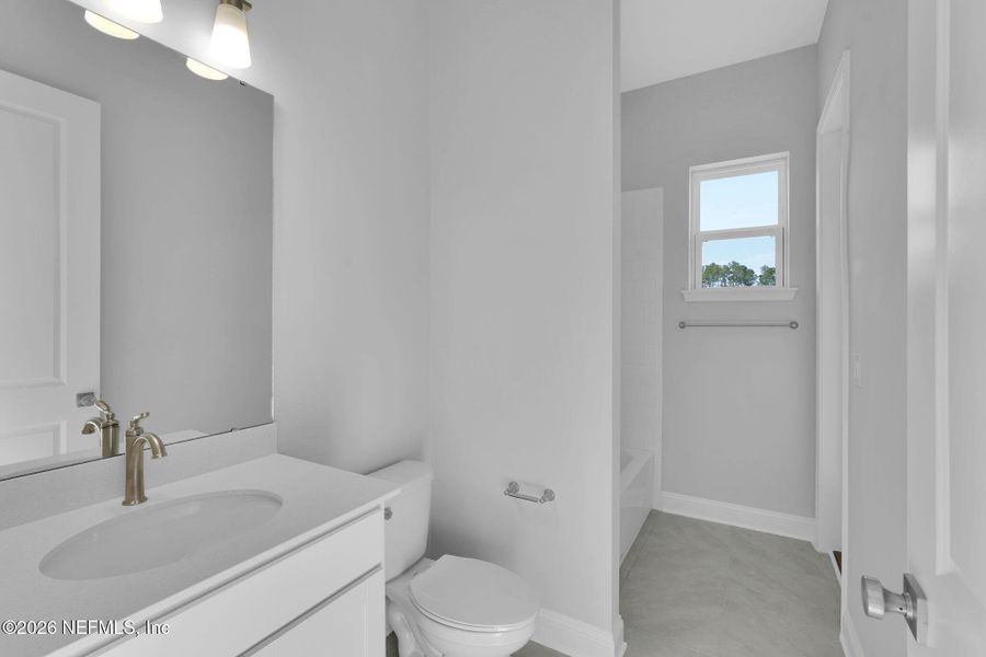 Furnished interior view inside a new home in Amelia National Country Club, Fernandina Beach (Image 9).