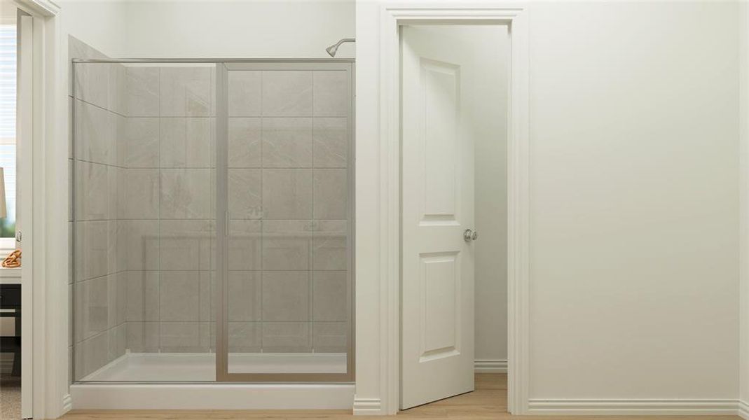 Bathroom with walk in shower and hardwood / wood-style flooring