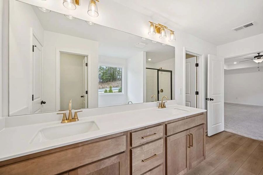 Sample Photo: Primary Bathroom featuring Laguna Collection Finishes