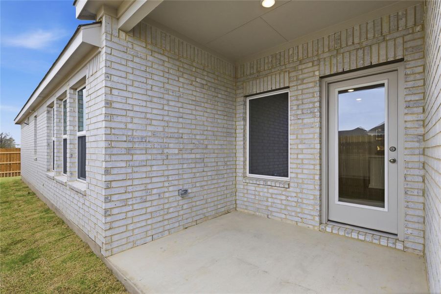Exterior details and patio area of a home in Infinity Square, Kyle (Image 3). Exterior details and patio area of a home in Infinity Square, Kyle (Image 3).