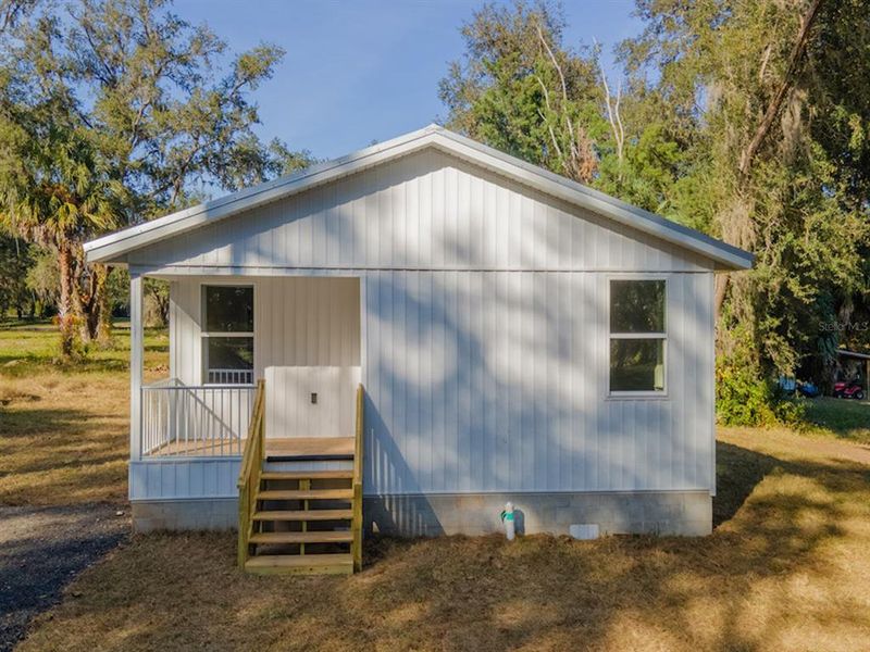 Exterior details and patio area of a home in , Fort McCoy (Image 20).