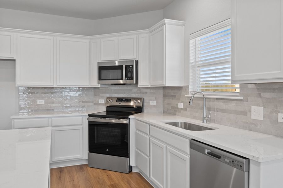 Representative furnished interior of a home built from the Austen by Omega Builders in North Point, Temple (Image 4).