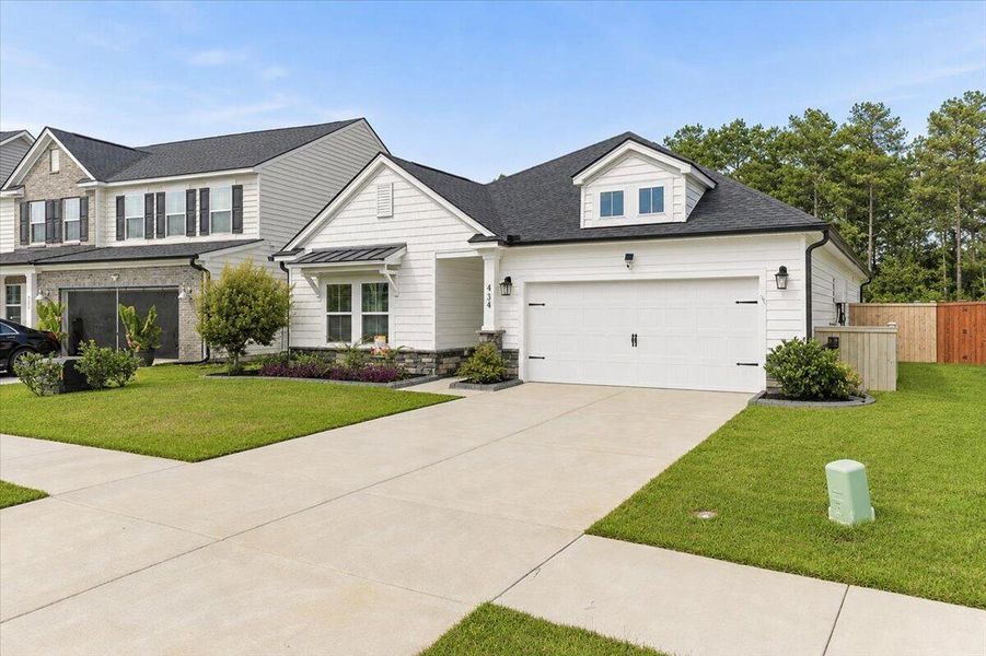 Front exterior of a new home in , Moncks Corner, SC, highlighting curb appeal (Image 23). Front exterior of a new home in , Moncks Corner, SC, highlighting curb appeal (Image 23).
