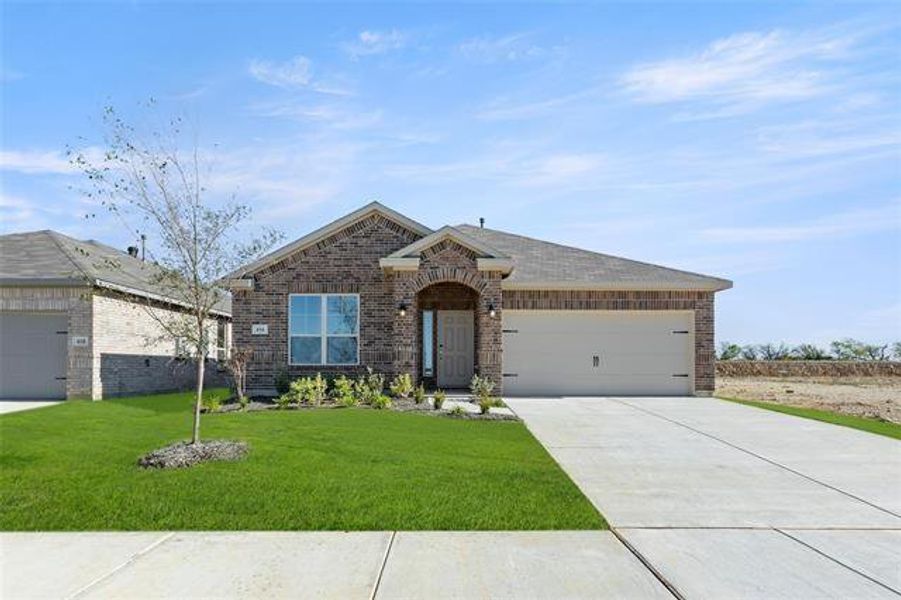 Single story home featuring a front lawn and a garage