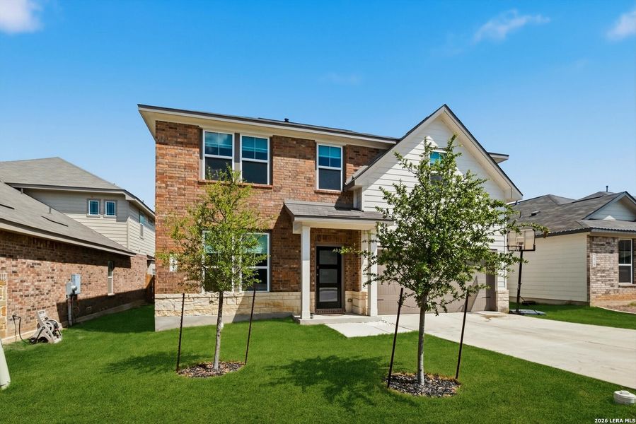 Front exterior of a new home in Horizon Pointe, Converse, TX, highlighting curb appeal (Image 24).