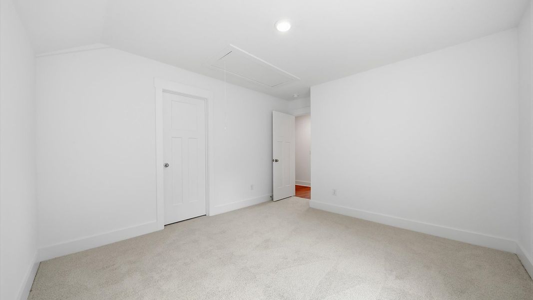 First-class secondary bedroom with comfortable carpeted flooring and generous closet space First-class secondary bedroom with comfortable carpeted flooring and generous closet space