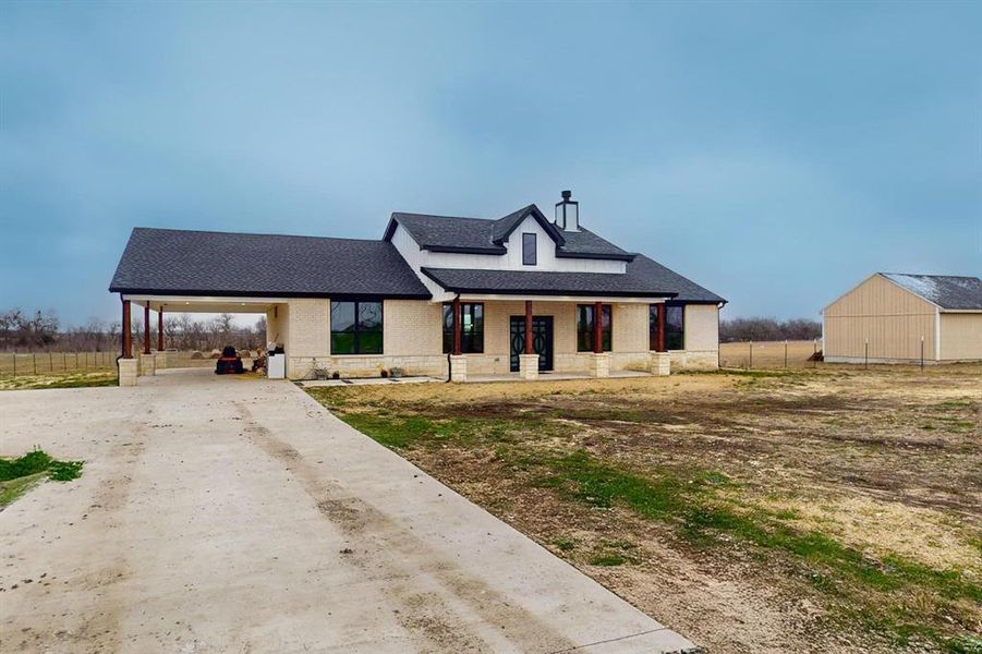 Front exterior of a new home in , Greenville, TX, highlighting curb appeal (Image 26). Front exterior of a new home in , Greenville, TX, highlighting curb appeal (Image 26).