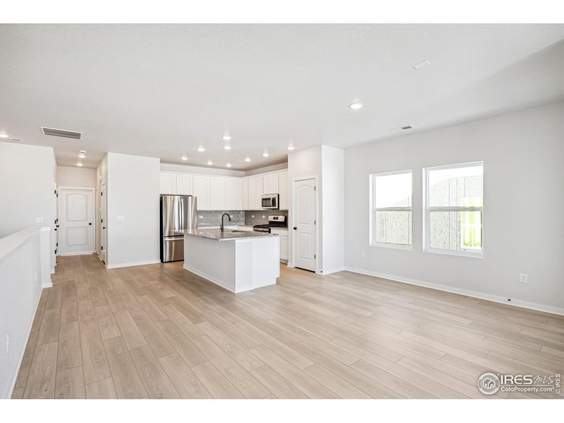 Spacious, unfurnished interior of a new home in Kinston Mainstreet Townhomes, Loveland (Image 34).