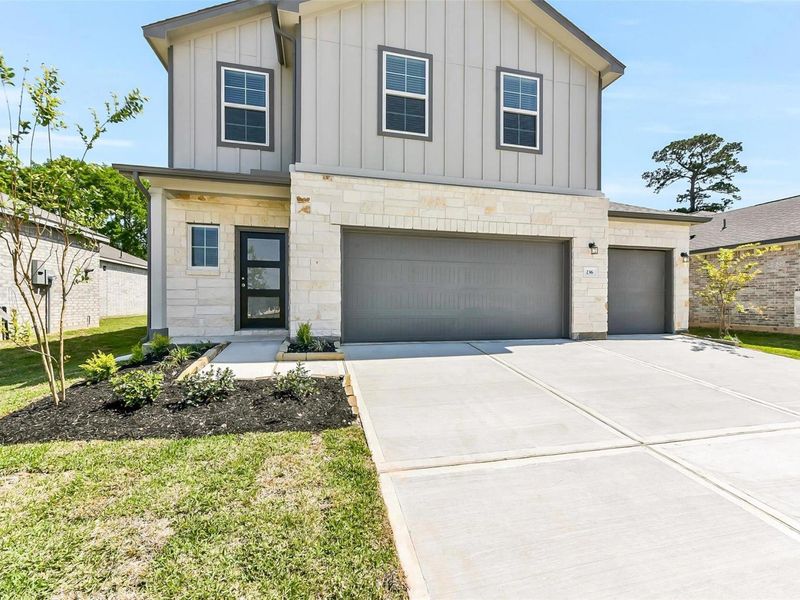Front exterior of a new home in Windmill Estates, Magnolia, TX, highlighting curb appeal (Image 27).