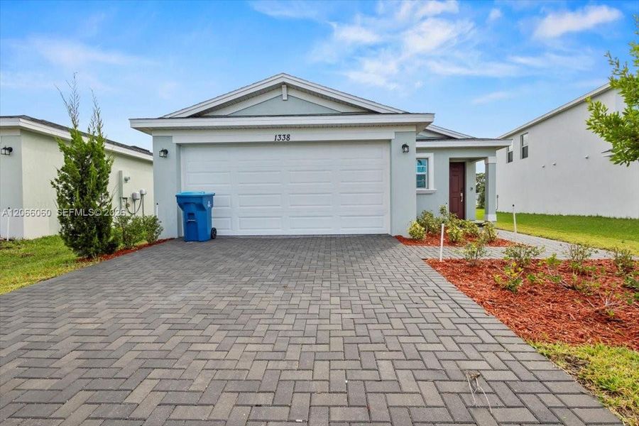 Front exterior of a new home in , Palm Bay, FL, highlighting curb appeal (Image 1). Front exterior of a new home in , Palm Bay, FL, highlighting curb appeal (Image 1).