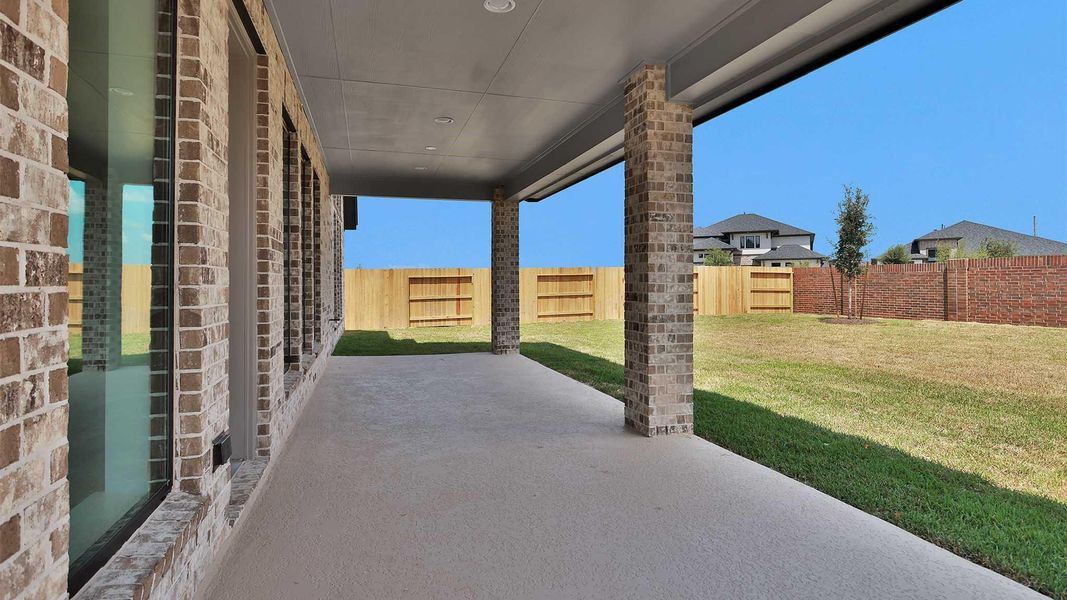 Exterior details and patio area of a home in Legacy Prairie at Katy Court, Katy (Image 2).