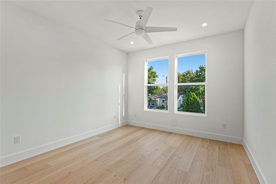 Unfurnished room with light wood-style flooring, recessed lighting, and a ceiling fan