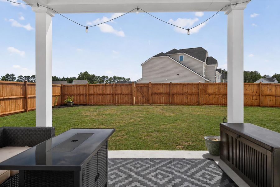Exterior details and patio area of a home in Lindera Preserve at Cane Bay Plantation, Summerville (Image 28).