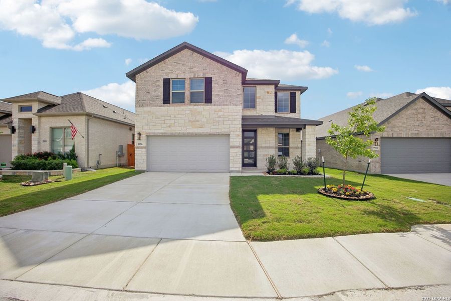 Front exterior of a new home in Kallison Ranch, San Antonio, TX, highlighting curb appeal (Image 1). Front exterior of a new home in Kallison Ranch, San Antonio, TX, highlighting curb appeal (Image 1).
