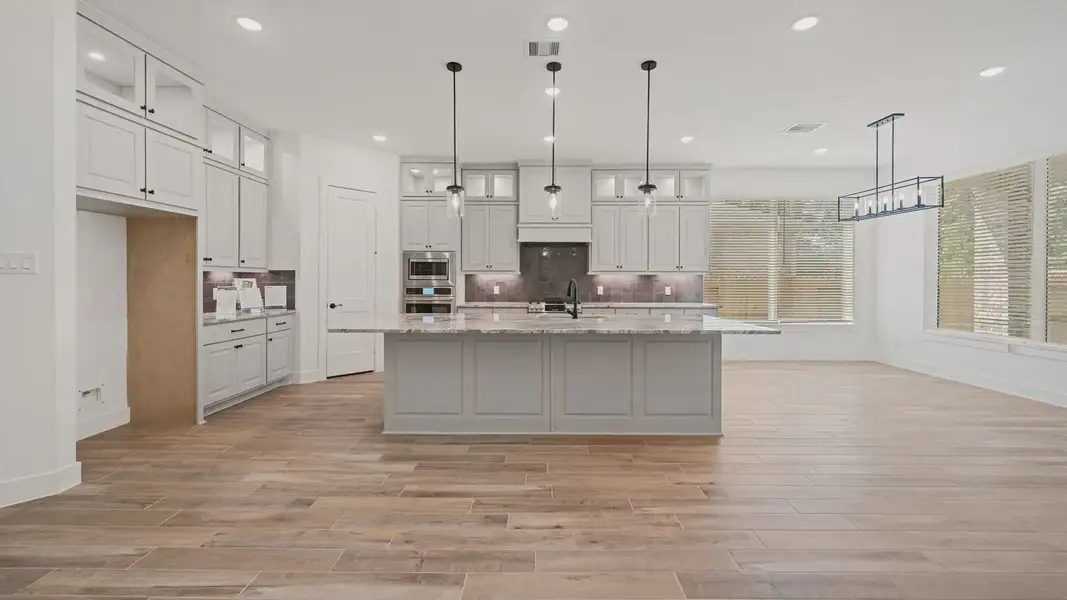 Representative furnished interior of a home built from the Waterloo by Chesmar Homes in Sofi Lakes, Katy (Image 4).