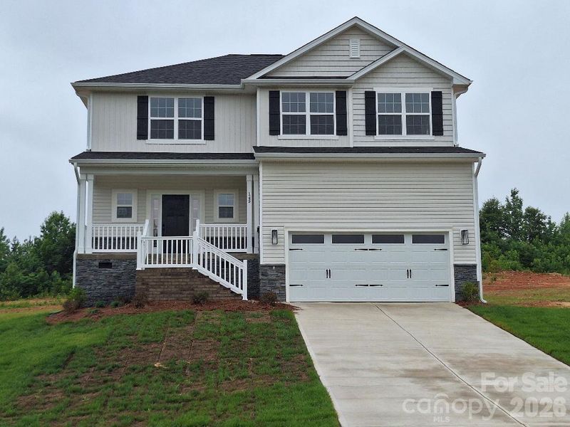 Front exterior of a new home in Northlake, Statesville, NC, highlighting curb appeal (Image 2). Front exterior of a new home in Northlake, Statesville, NC, highlighting curb appeal (Image 2).