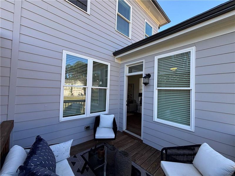 Exterior details and patio area of a home in Brackley Townhomes, Cumming (Image 3). Exterior details and patio area of a home in Brackley Townhomes, Cumming (Image 3).