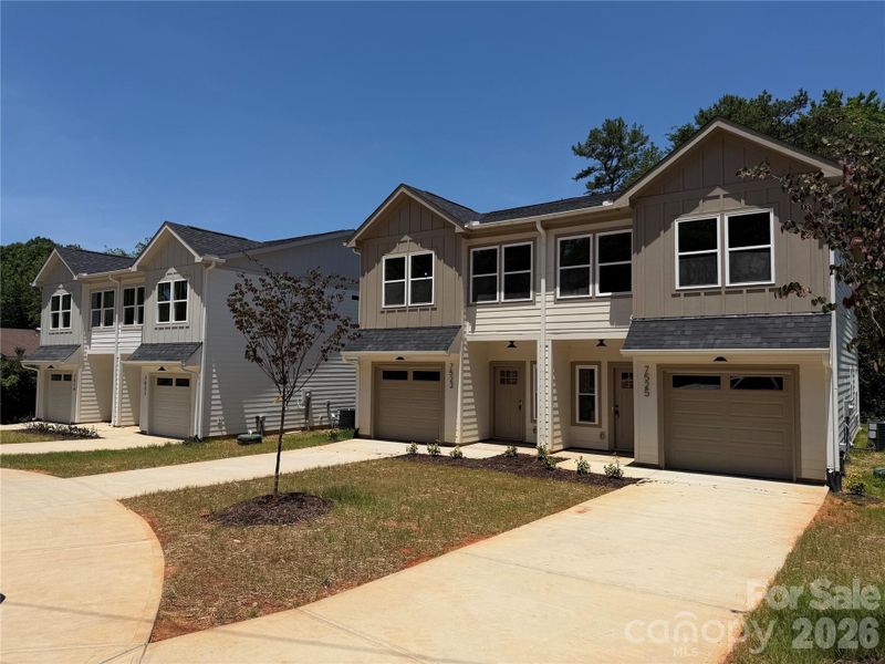 Front exterior of a new home in , Charlotte, NC, highlighting curb appeal (Image 25).