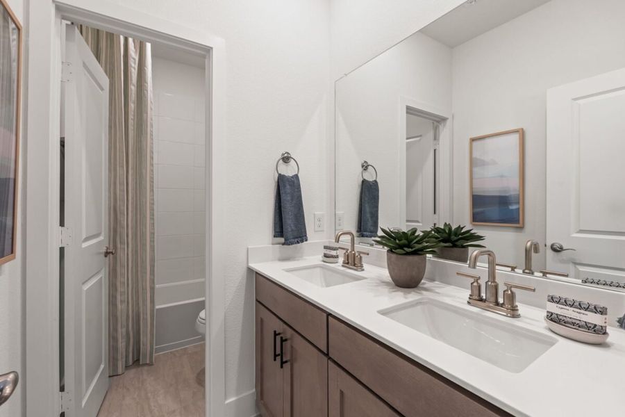 Furnished interior in a model home at Enclave 35s in Frisco (Image 9).