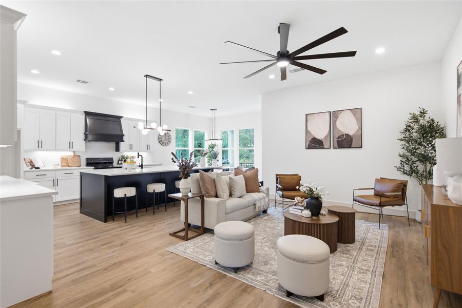 An open-concept living area boasts a modern kitchen with a spacious island, perfect for entertaining. An open-concept living area boasts a modern kitchen with a spacious island, perfect for entertaining.