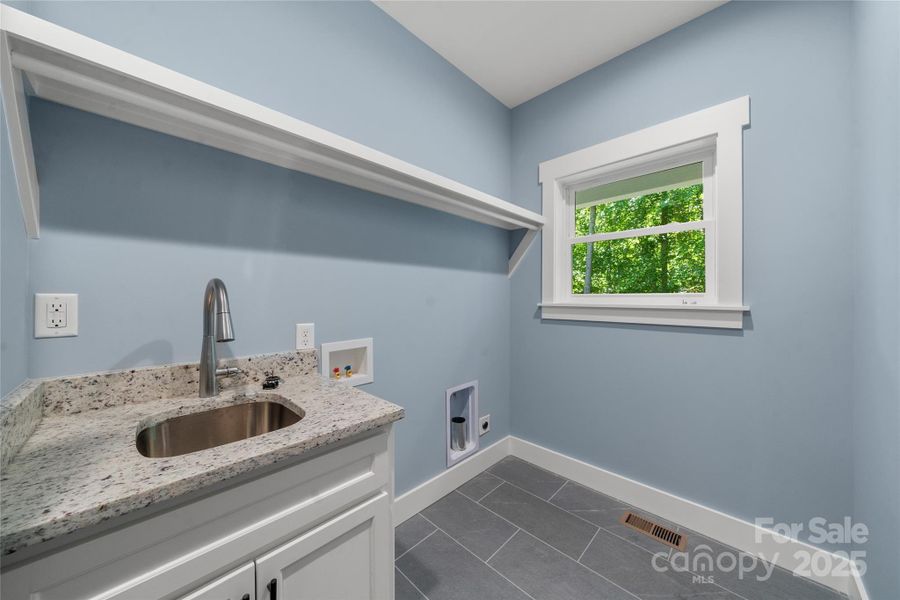 Beautiful, large main level utility room