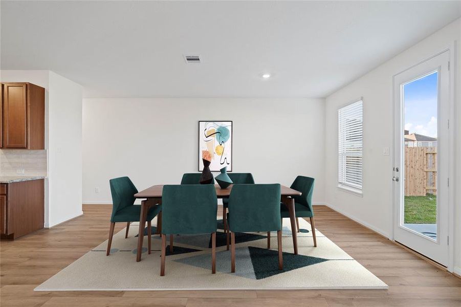 Make memories gathered around the table with your family and friends! This dining room features high ceilings, recessed lighting, large window with privacy blinds, vinyl plank flooring, and neutral paint!