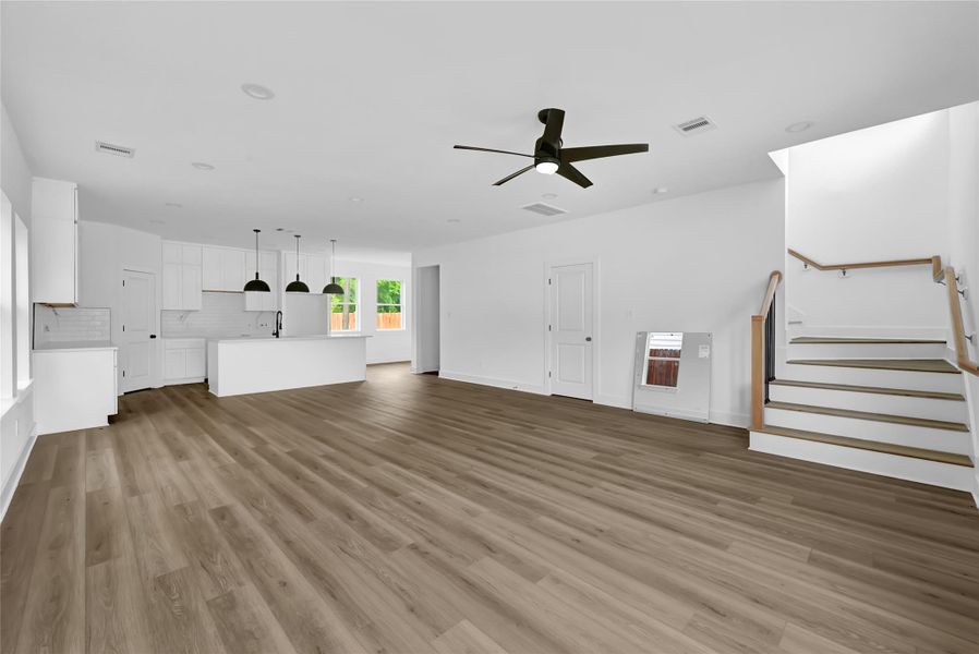 Spacious living area with soaring ceilings and natural light. Spacious living area with soaring ceilings and natural light.