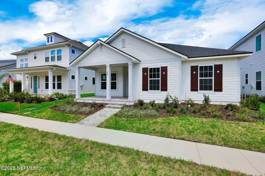 Front exterior of a new home in Seabrook Village at Seabrook, Ponte Vedra, FL, highlighting curb appeal (Image 21).
