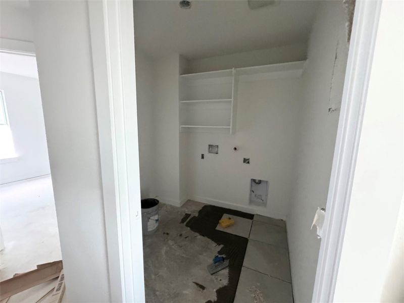 Laundry room featuring gas dryer hookup, hookup for an electric dryer, washer hookup, and unfinished concrete flooring