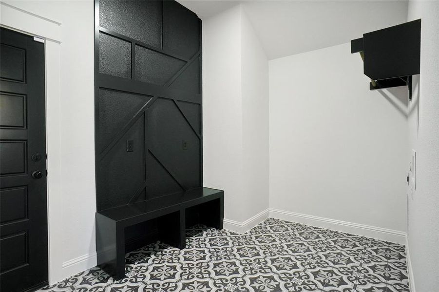 Mudroom featuring tile patterned flooring