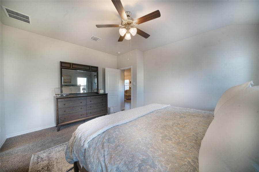 Bedroom with carpet flooring and ceiling fan
