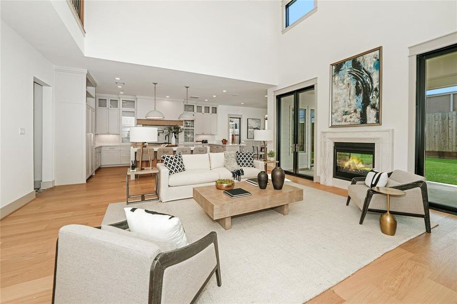 Living Room with open floorplan to kitchen and dining room .