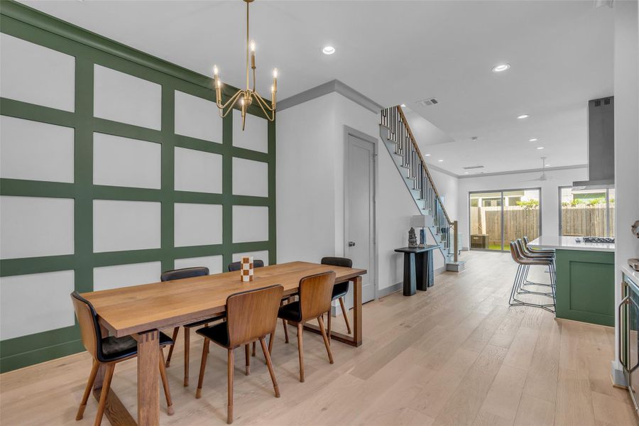 This view showcases the formal dining area, providing a welcoming space for family meals, holiday gatherings, and entertaining guests.