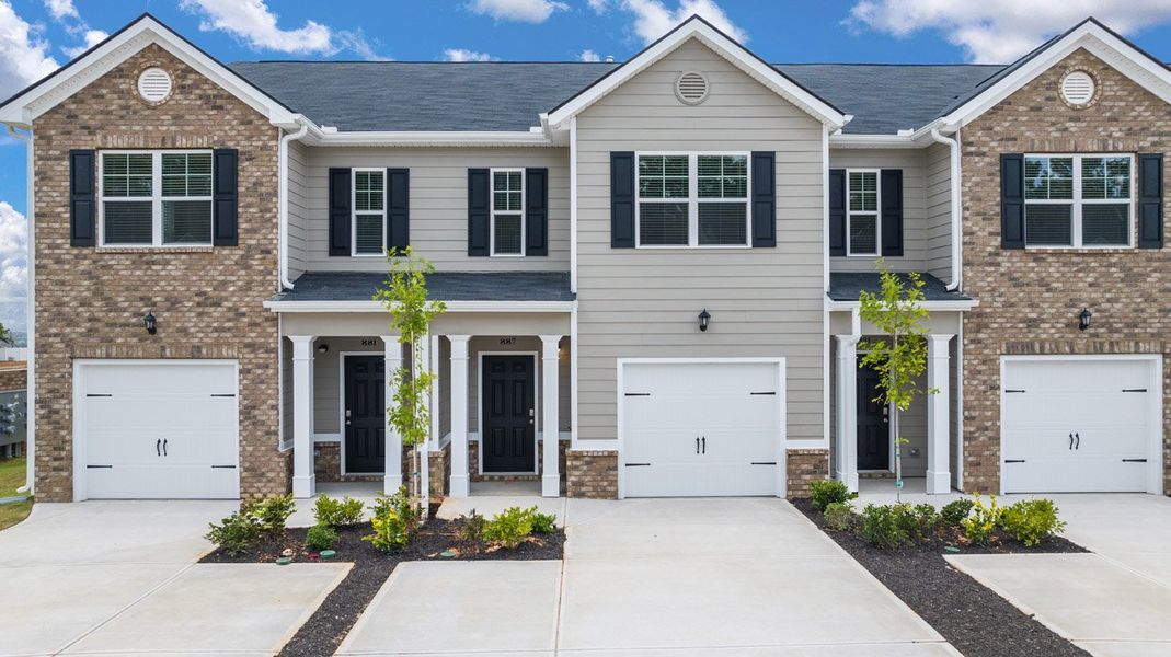 Front exterior of a new home in The Parish at Flat Rock Townhomes, Graniteville, SC, highlighting curb appeal (Image 1). Front exterior of a new home in The Parish at Flat Rock Townhomes, Graniteville, SC, highlighting curb appeal (Image 1).