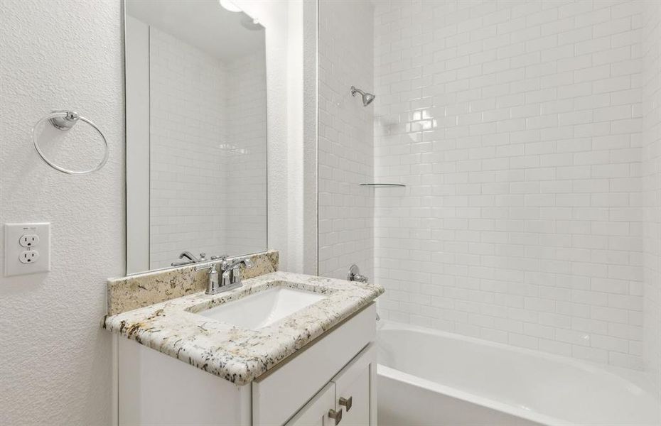 Stylish secondary bath with high-end fixtures *Real home pictured