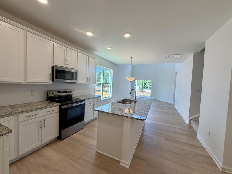 Furnished interior view inside a new home in Bellevue Townhomes, Greenville (Image 6).