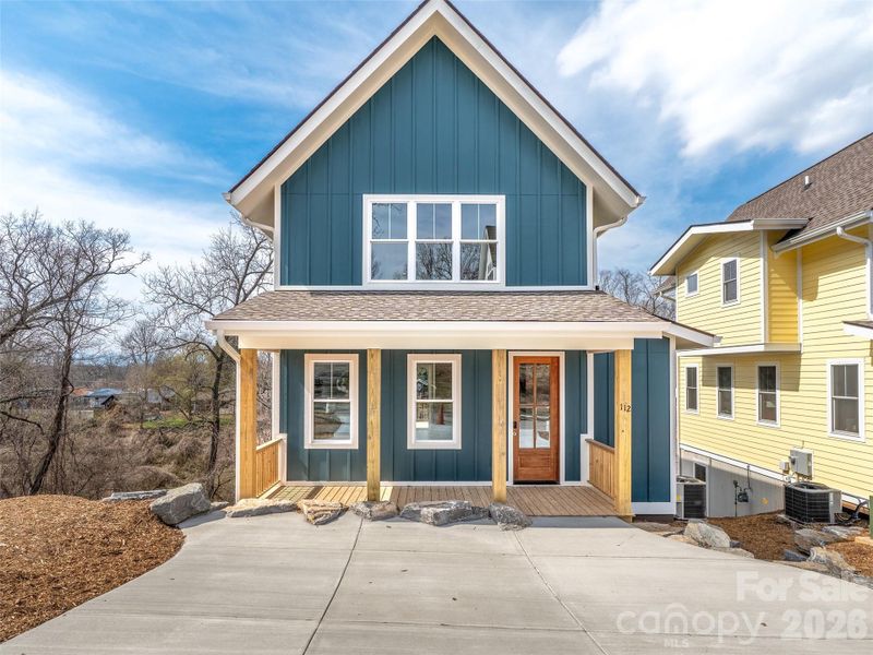 Front exterior of a new home in , Asheville, NC, highlighting curb appeal (Image 25).