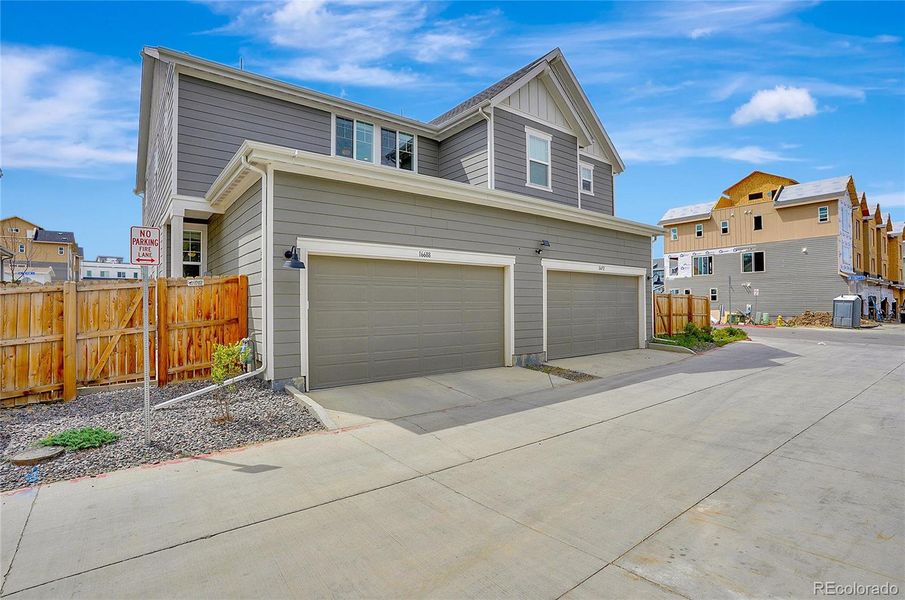 Front exterior of a new home in , Broomfield, CO, highlighting curb appeal (Image 25).