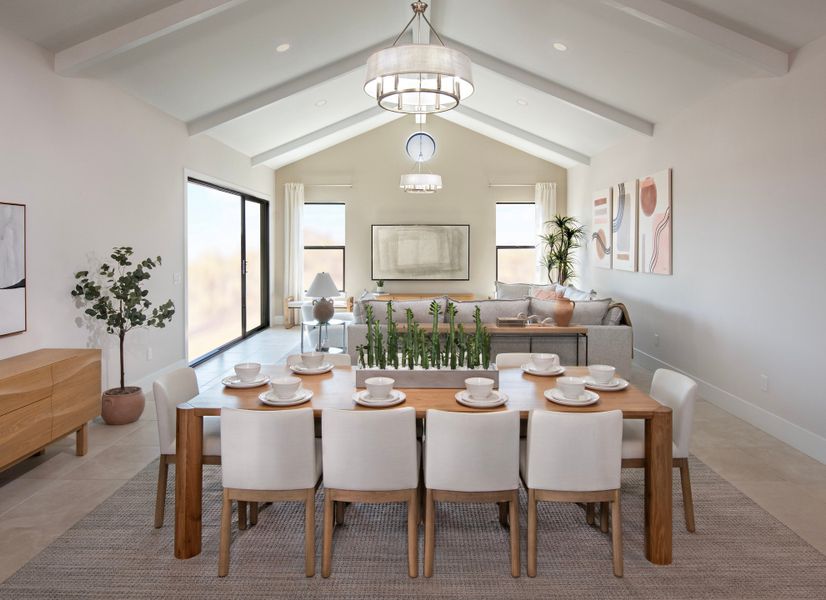 Dining area with vaulted ceiling and chandelier Dining area with vaulted ceiling and chandelier