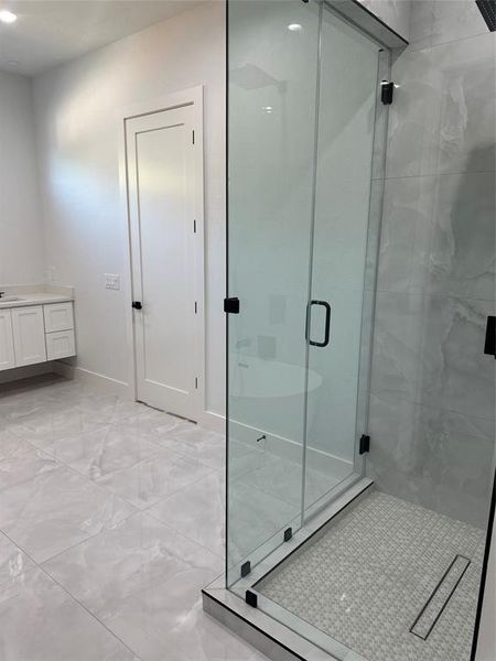 Bathroom with vanity and an enclosed shower