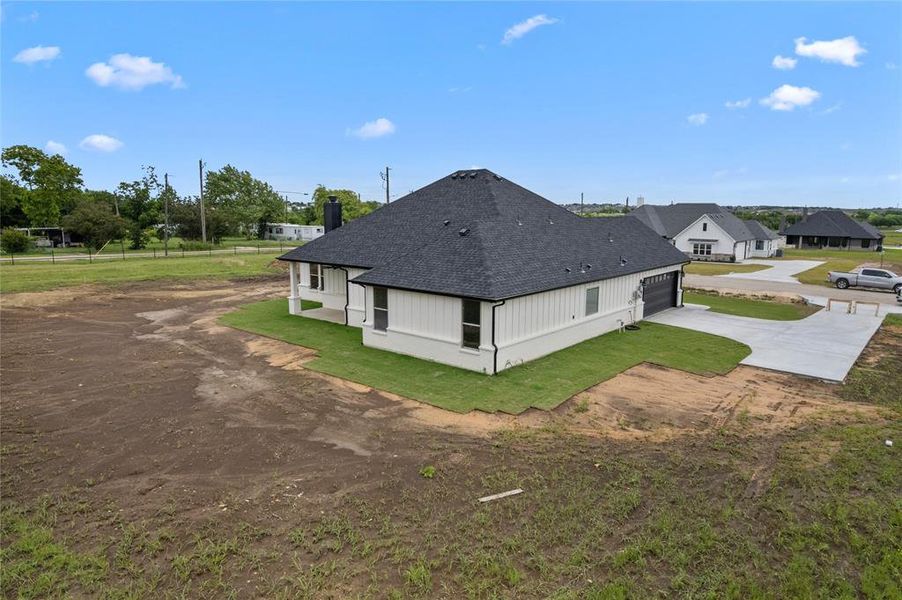 Front exterior of a new home in , Godley, TX, highlighting curb appeal (Image 16).