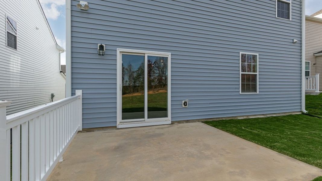 Exterior details and patio area of a home in The Grove at Matthews Landing, Fuquay Varina (Image 18). Exterior details and patio area of a home in The Grove at Matthews Landing, Fuquay Varina (Image 18).