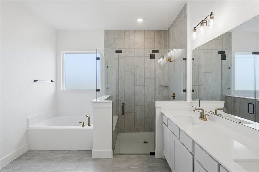 Full bath featuring double vanity, a bath, and a shower stall