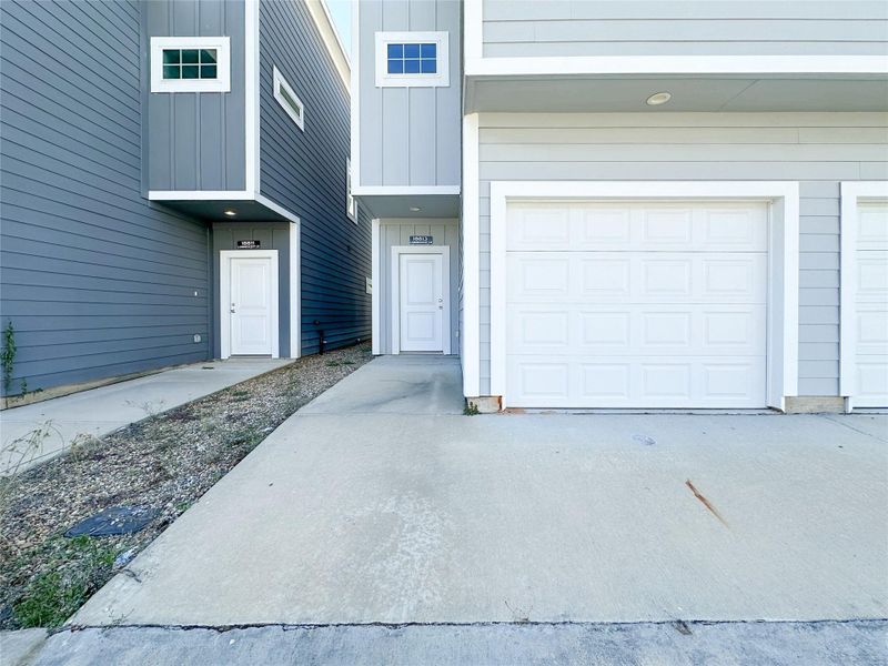 Front exterior of a new home in , Spring, TX, highlighting curb appeal (Image 13).