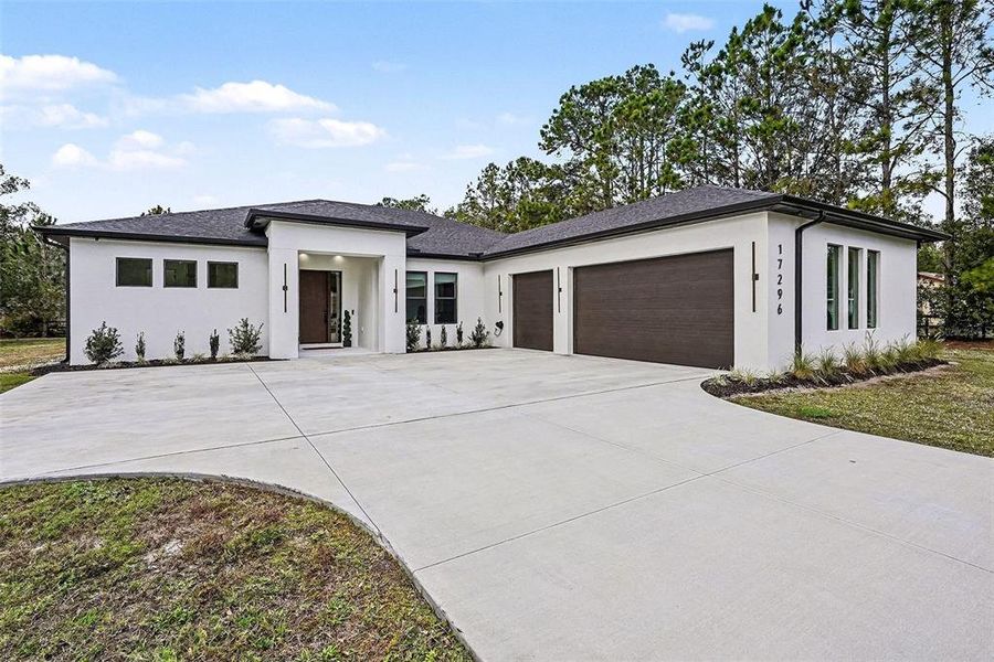 Front exterior of a new home in , Lutz, FL, highlighting curb appeal (Image 29).