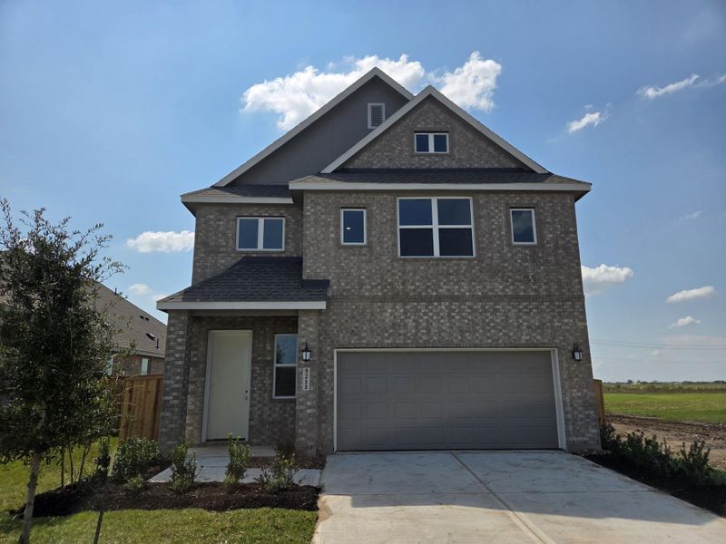 Front exterior of a new home in Esperanza: Avante Collection, Richmond, TX, highlighting curb appeal (Image 2). Front exterior of a new home in Esperanza: Avante Collection, Richmond, TX, highlighting curb appeal (Image 2).