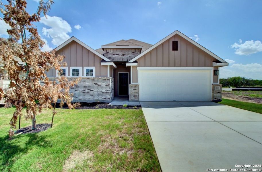 Front exterior of a new home in Prairie Green, Converse, TX, highlighting curb appeal (Image 1). Front exterior of a new home in Prairie Green, Converse, TX, highlighting curb appeal (Image 1).
