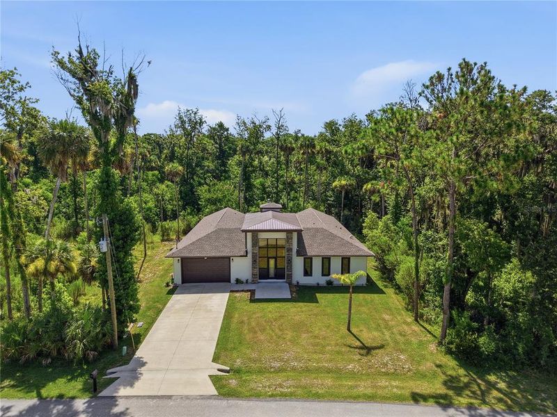 Front exterior of a new home in , Palm Coast, FL, highlighting curb appeal (Image 21). Front exterior of a new home in , Palm Coast, FL, highlighting curb appeal (Image 21).